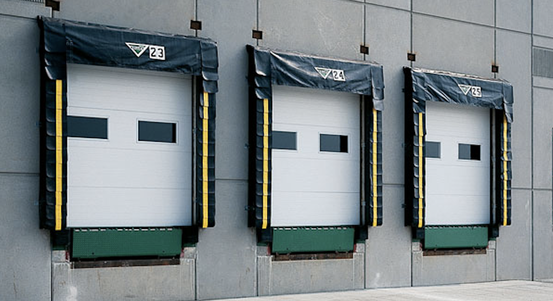Loading docks with overhead doors on an industrial building