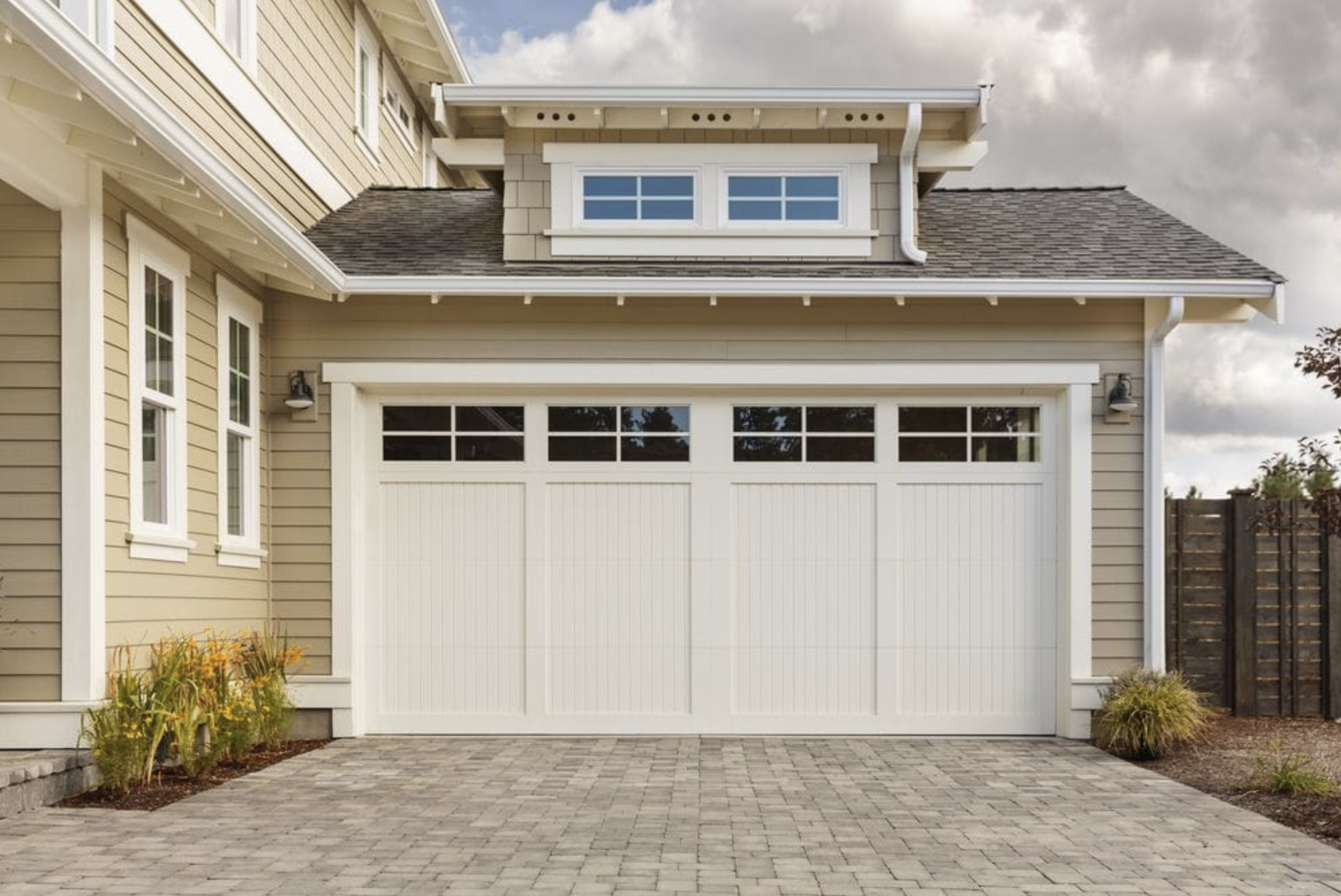 Modern suburban house with a stylish white garage door